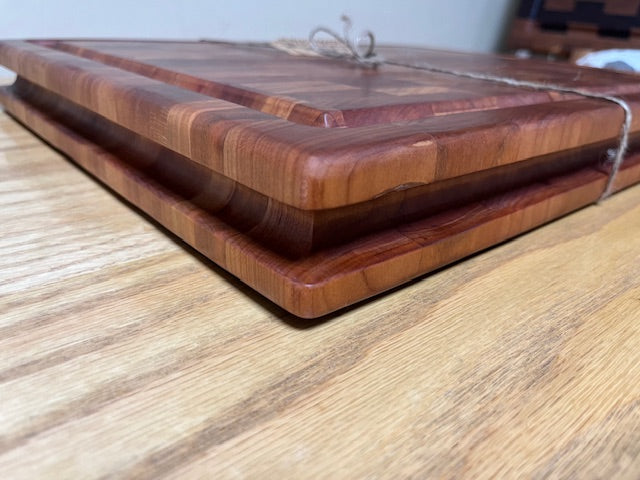 19-1/4"X15-1/4"X2" Cherry End Grain Cutting Board W/juice groove and hand hold groove around the edges.