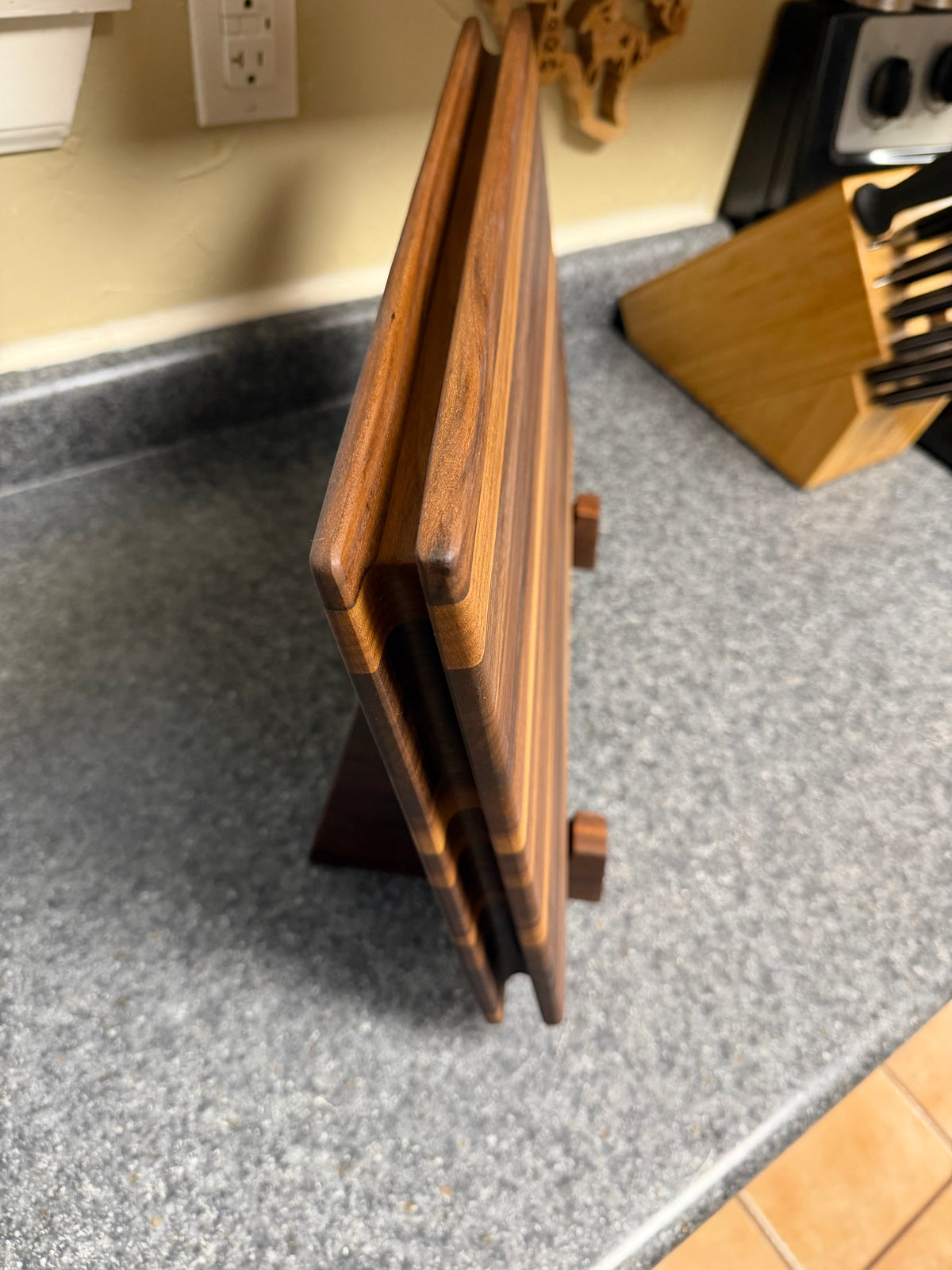 17-1/2"X11-1/2"X1-1/2" Walnut Edge Grain Cutting Board w/Unique Hand Hold around the sides.