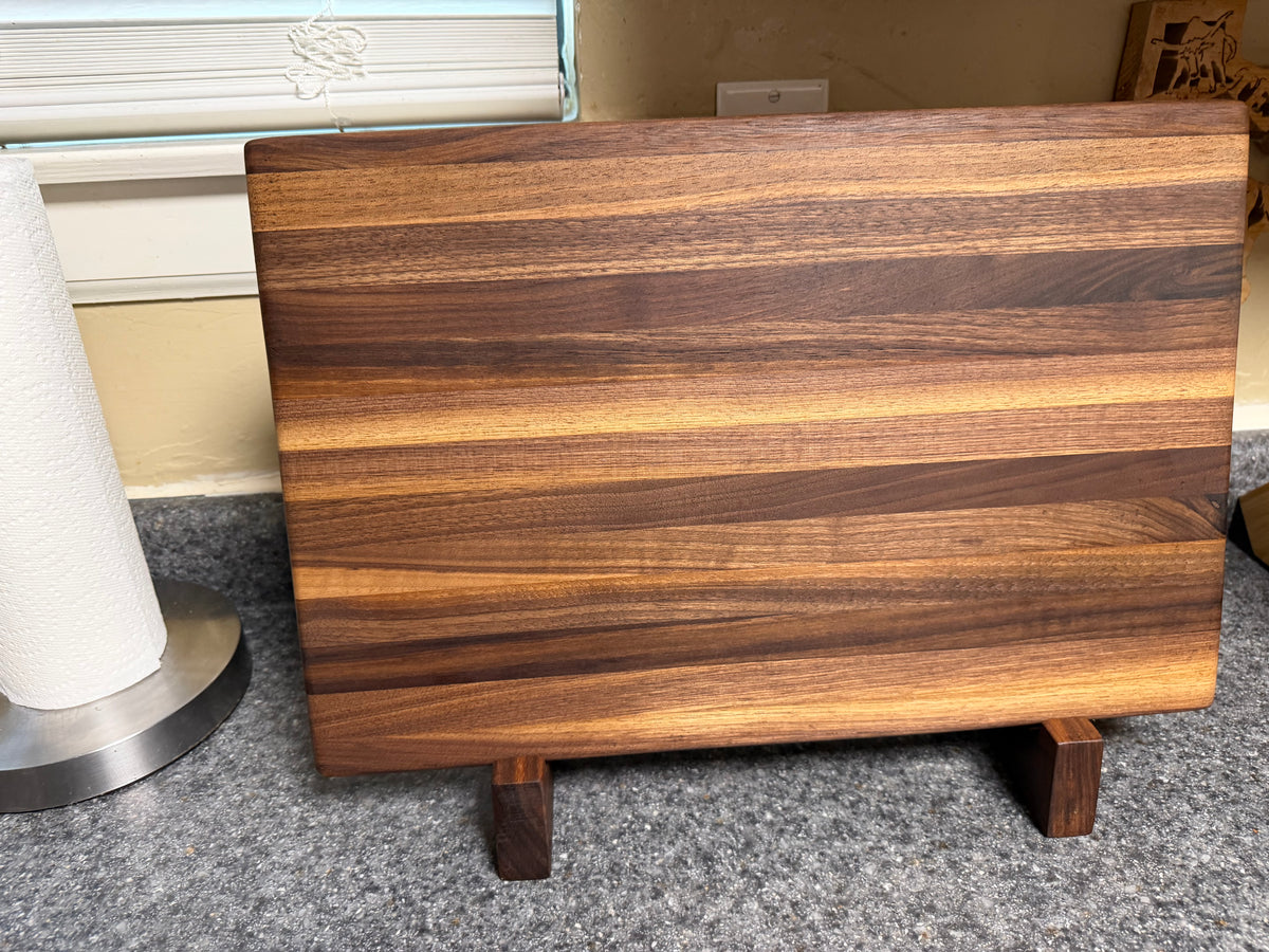 17-1/2"X11-1/2"X1-1/2" Walnut Edge Grain Cutting Board w/Unique Hand Hold around the sides.