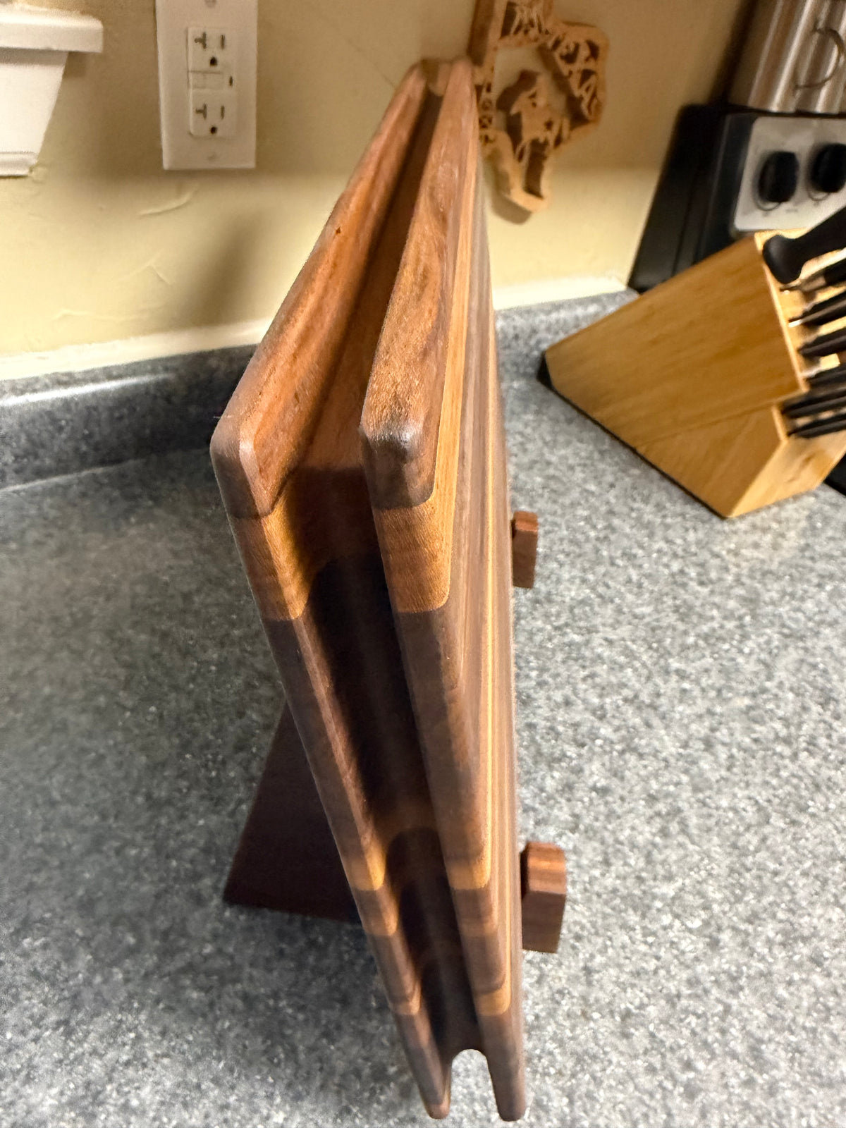17-1/2"X11-1/2"X1-1/2" Walnut Edge Grain Cutting Board w/Unique Hand Hold around the sides.