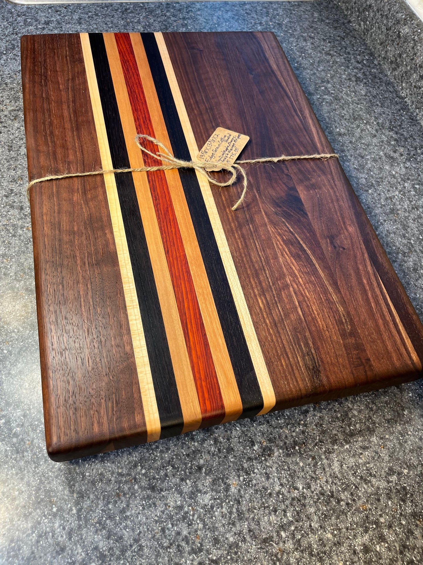 19-5/8"L X 13"W X 2"H Walnut edge grain cutting board with cherry, maple, African wenge & padauk accent strips.