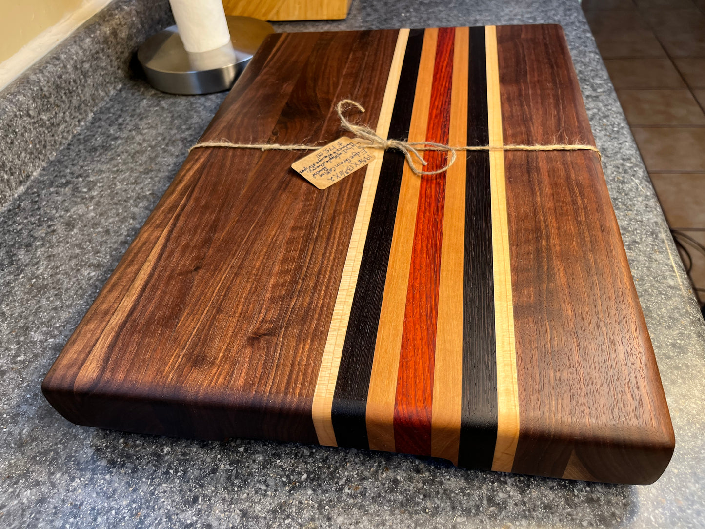 19-5/8"L X 13"W X 2"H Walnut edge grain cutting board with cherry, maple, African wenge & padauk accent strips.