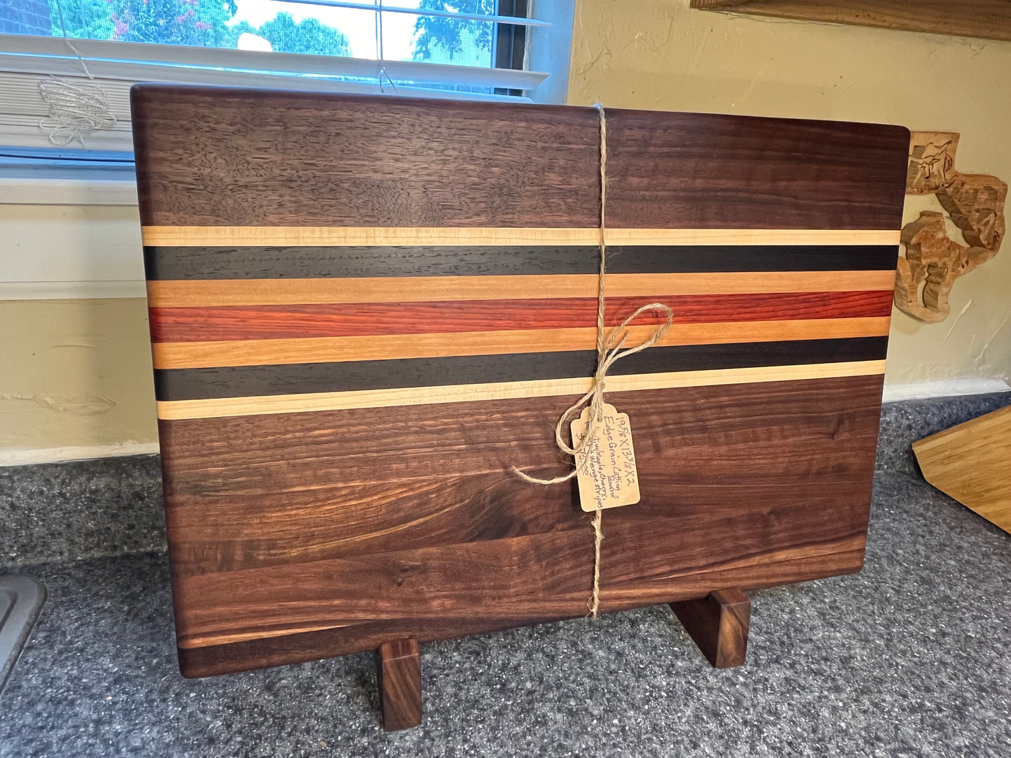 19-5/8"L X 13"W X 2"H Walnut edge grain cutting board with cherry, maple, African wenge & padauk accent strips.