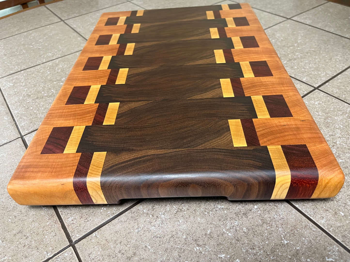 18-1/4" X 12-3/4" X 1-3/4" End Grain Cutting Board-Walnut and Cherry with Maple/Padauk accent strips-Hand holds cut on bottom ends and rubber feet attached