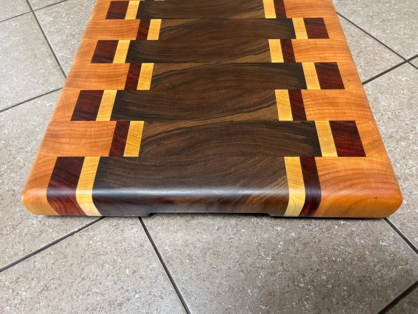 18-1/4" X 12-3/4" X 1-3/4" End Grain Cutting Board-Walnut and Cherry with Maple/Padauk accent strips-Hand holds cut on bottom ends and rubber feet attached