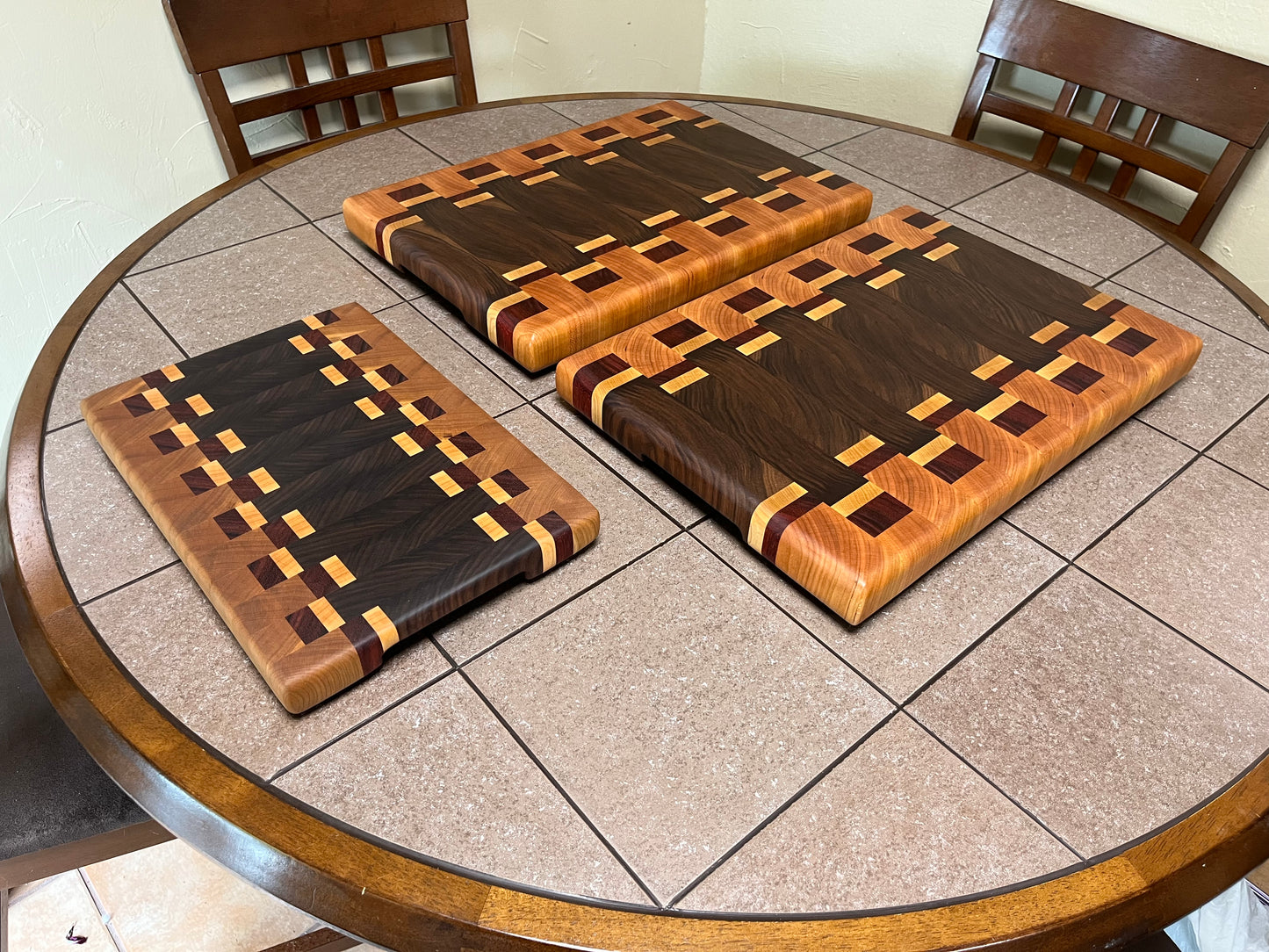 18-1/4" X 12-3/4" X 1-3/4" End Grain Cutting Board-Walnut and Cherry with Maple/Padauk accent strips-Hand holds cut on bottom ends and rubber feet attached