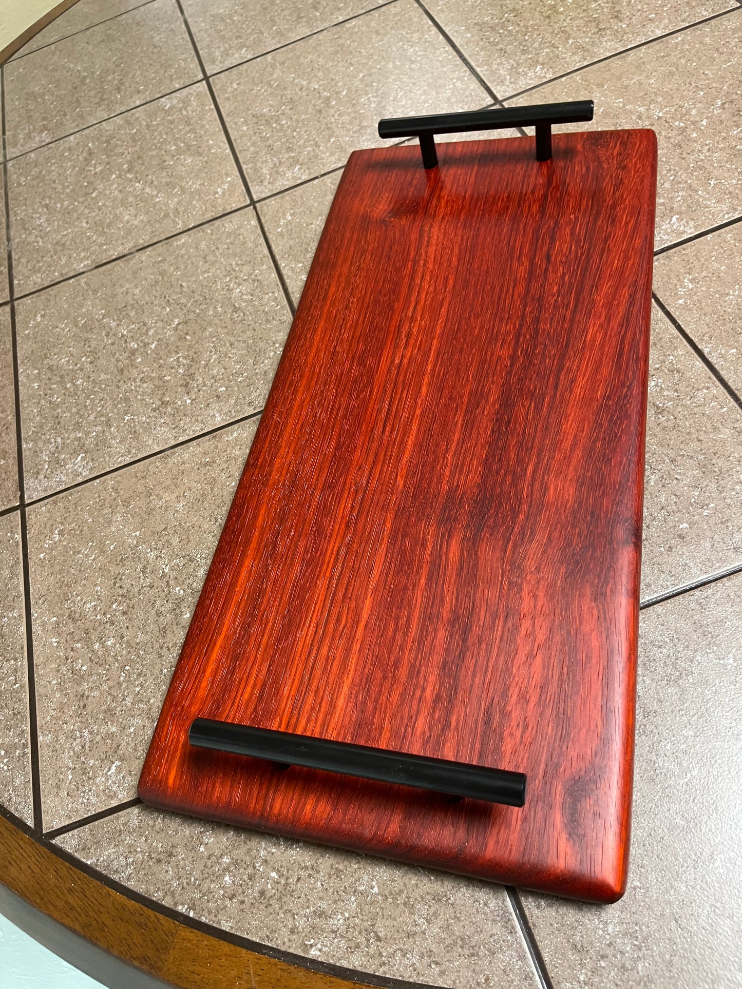 African Padauk 18"X 8-1/2" X 7/8" Serving Board w/black handles attached