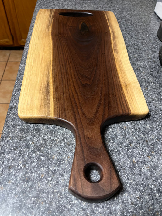 23-3/4"L X 9-1-2"to 10-1/2"W X 15/16"H Walnut Live Edge Charcuterie Serving Board