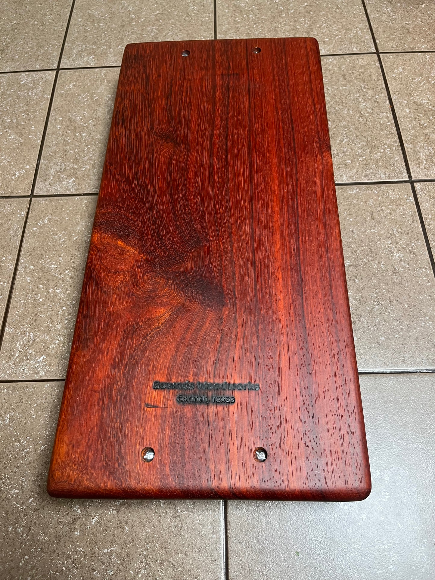 African Padauk 18"X 8-1/2" X 7/8" Serving Board w/black handles attached