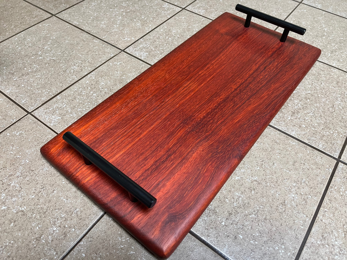 African Padauk 18"X 8-1/2" X 7/8" Serving Board w/black handles attached