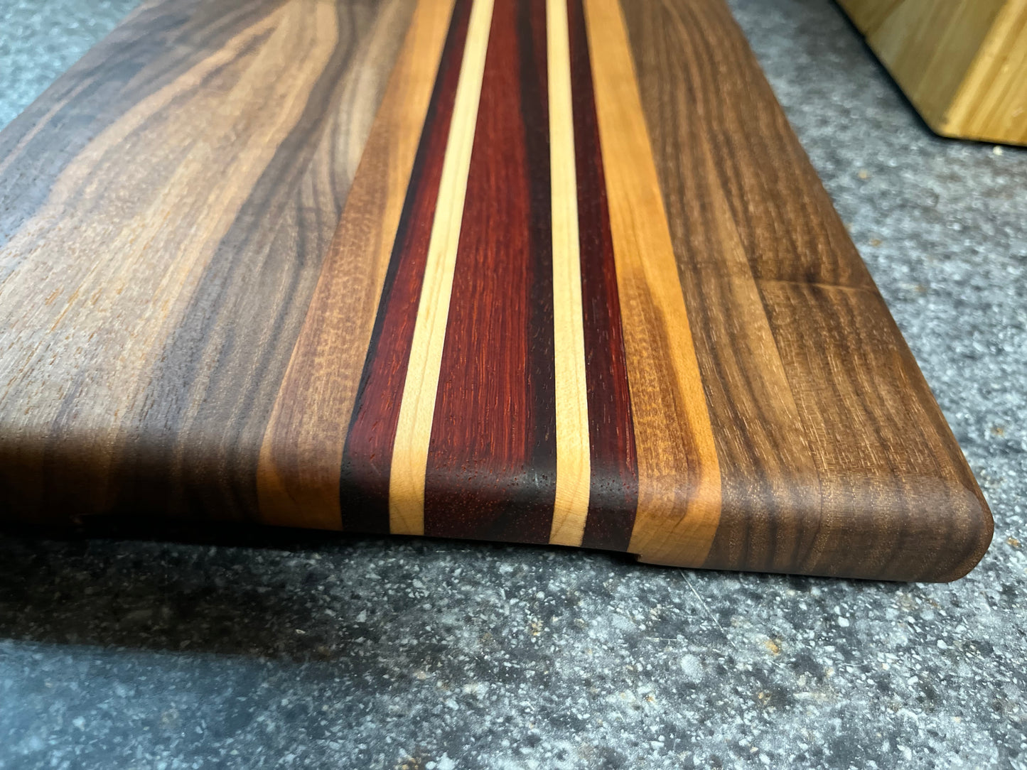 13-7/8"L X 9-7/8"W X 1"H Edge Grain Walnut Cutting Board with Cherry, Maple, Padauk accent strips