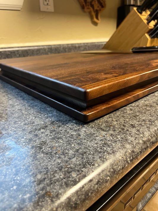 20"X16-1/4"X2" Walnut Edge Grain Cutting Board with unique hand all the way around the edges. No rubber feet.