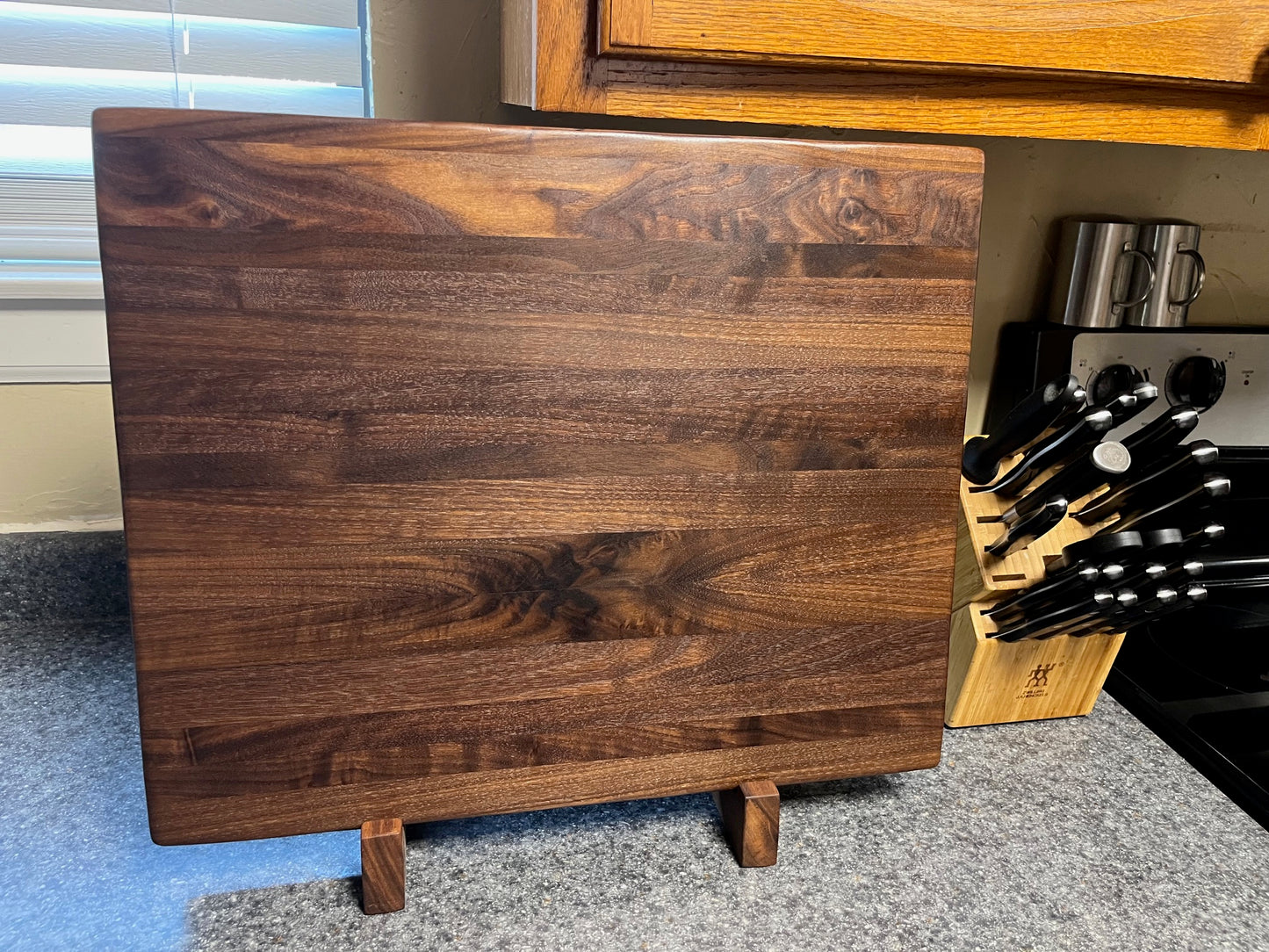 20"X16-1/4"X2" Walnut Edge Grain Cutting Board with unique hand all the way around the edges. No rubber feet.