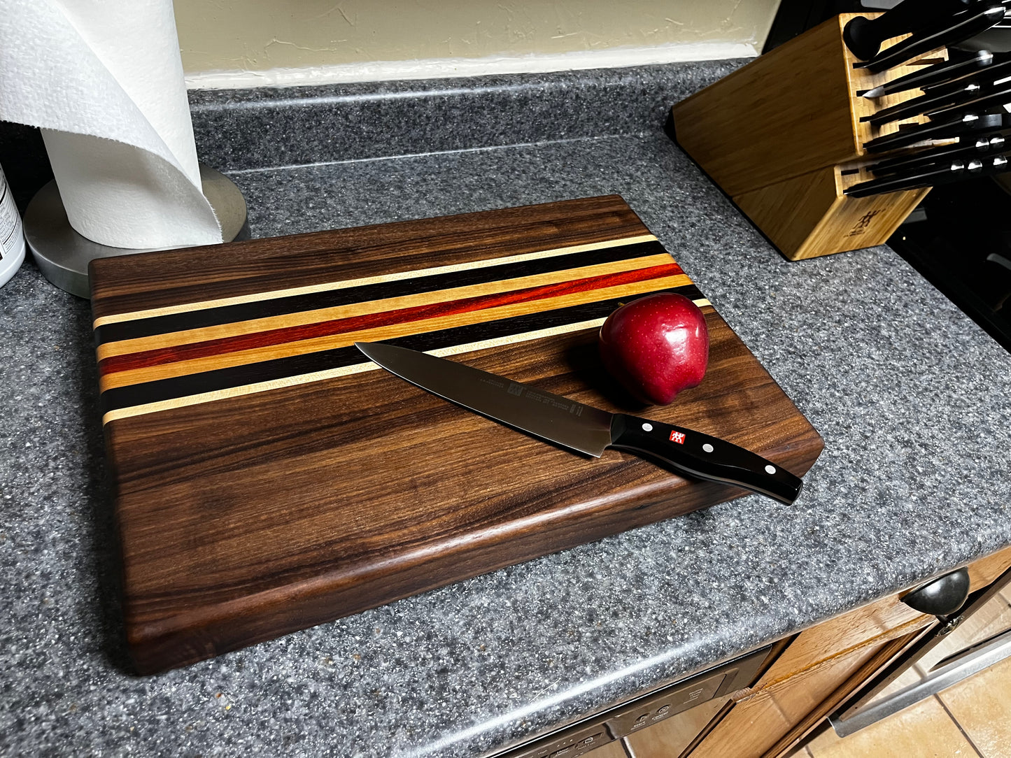 19"L X 13"W X 2"H Walnut edge grain cutting board with cherry, maple, African wenge & padauk accent strips.