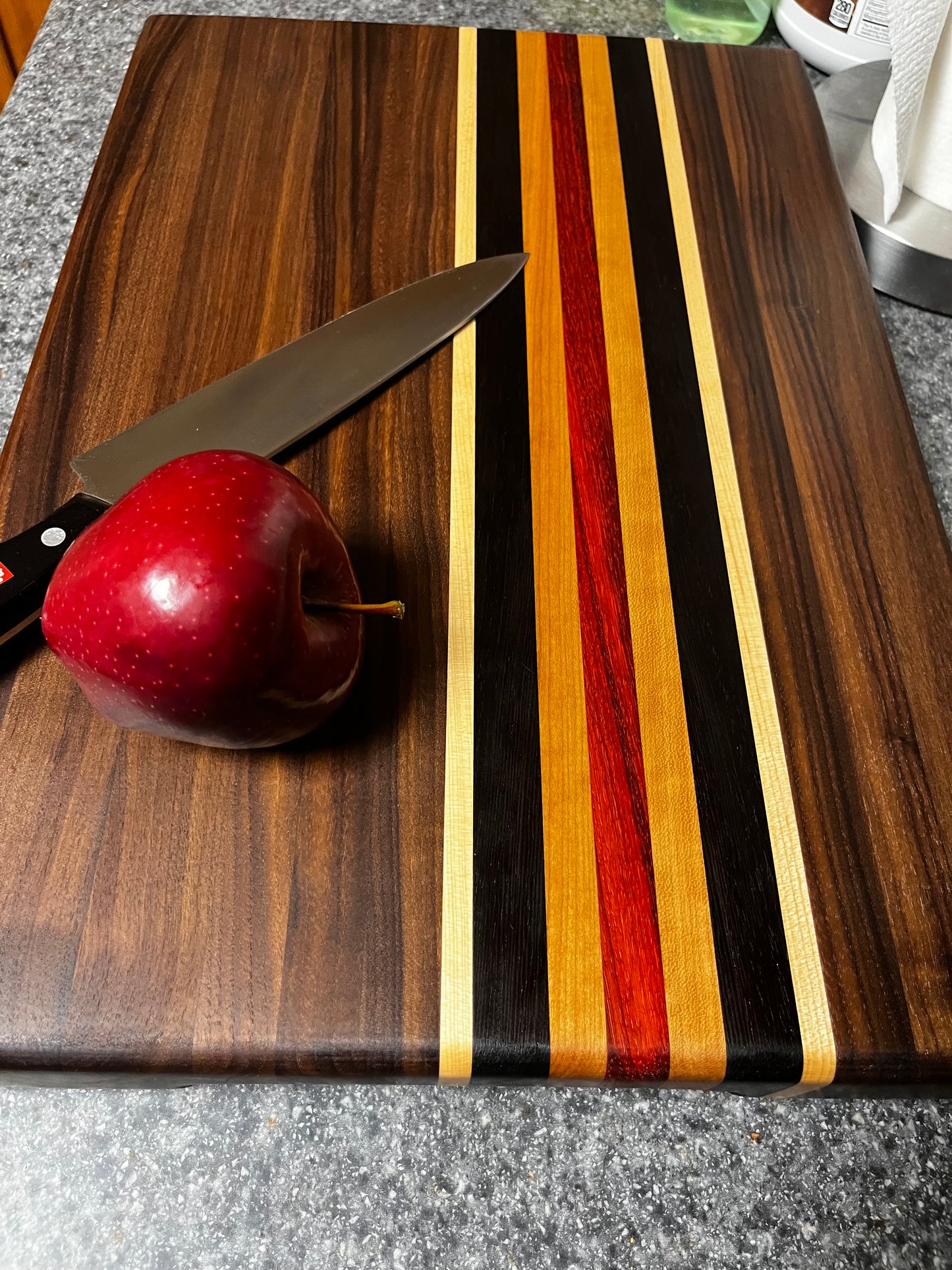 19"L X 13"W X 2"H Walnut edge grain cutting board with cherry, maple, African wenge & padauk accent strips.