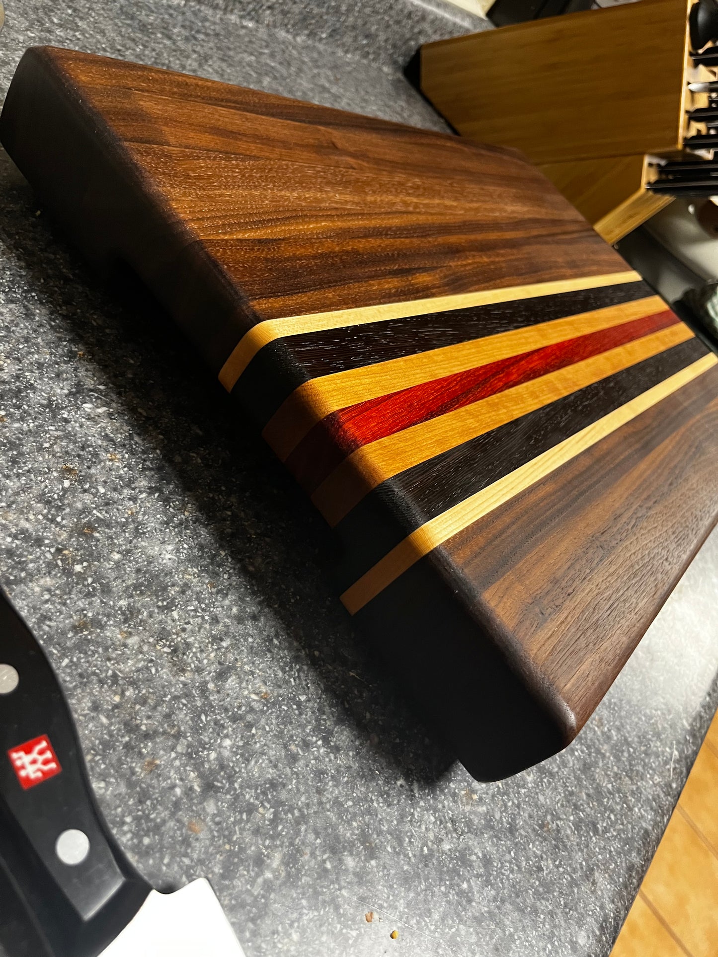 19"L X 13"W X 2"H Walnut edge grain cutting board with cherry, maple, African wenge & padauk accent strips.